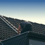 Clay tile roofer installing clay tiles